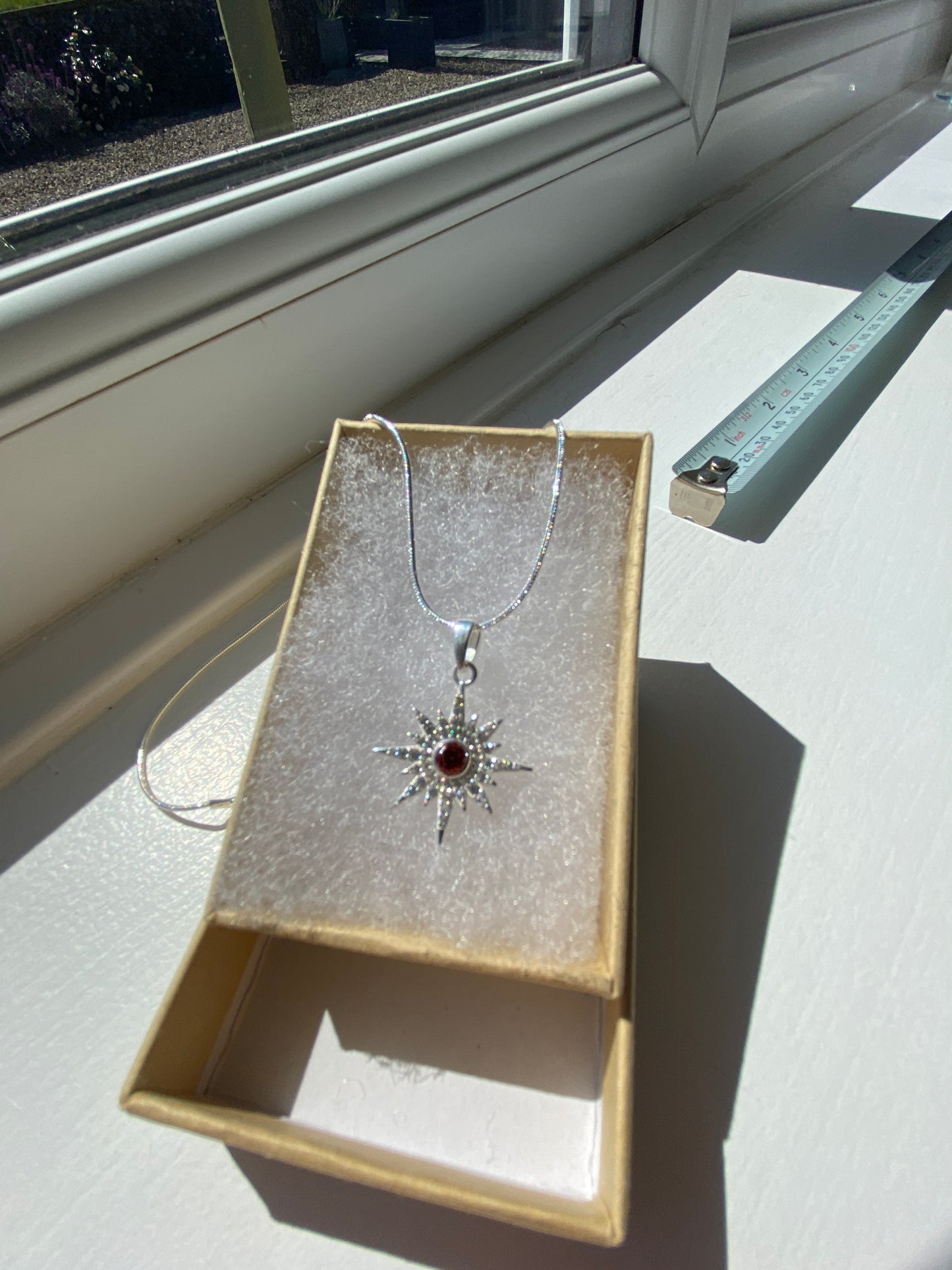 Garnet & White Topaz Starburst Silver Pendant Necklace