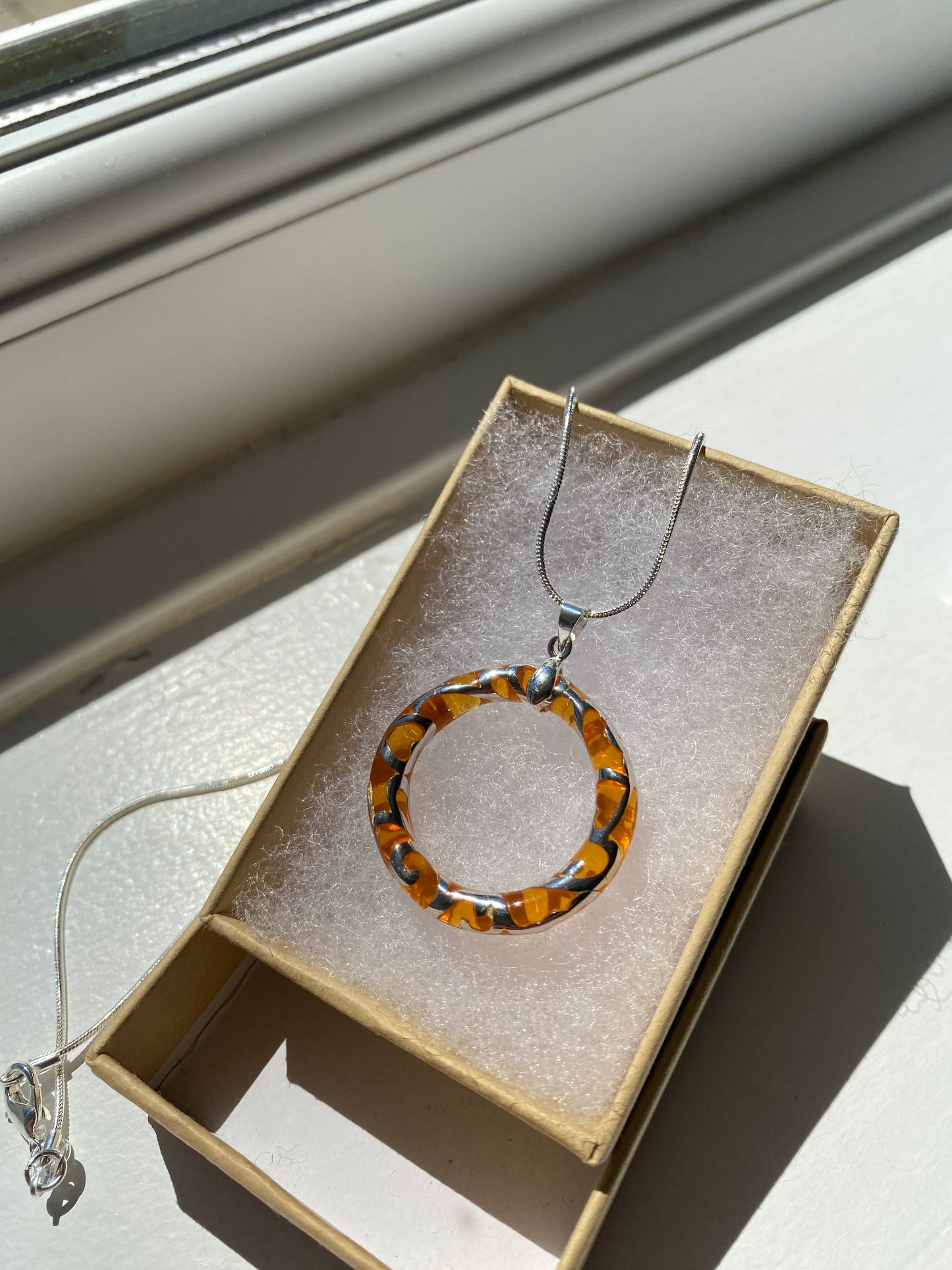 Circular Orange & Silver Pendant