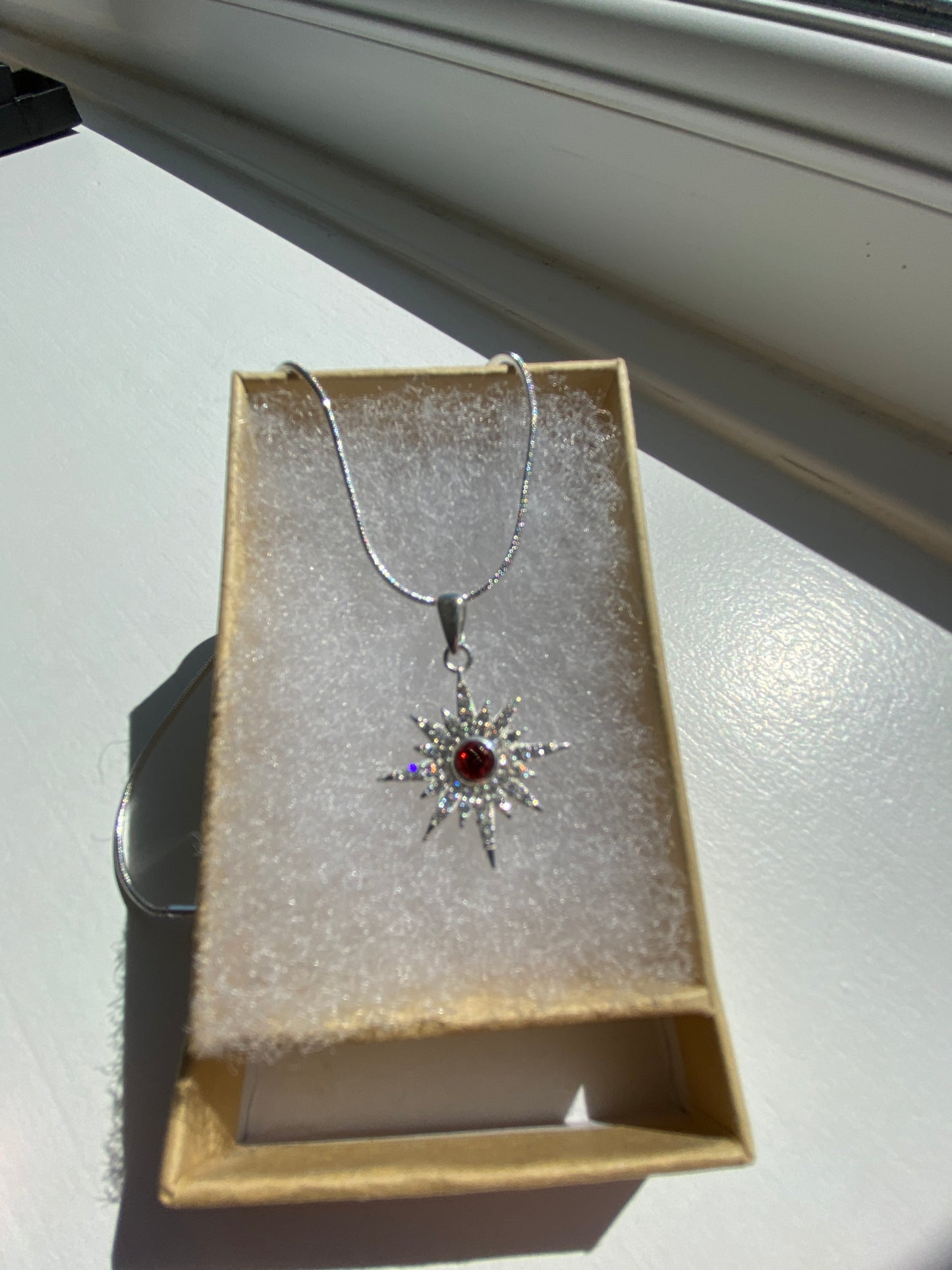 Garnet & White Topaz Starburst Silver Pendant Necklace