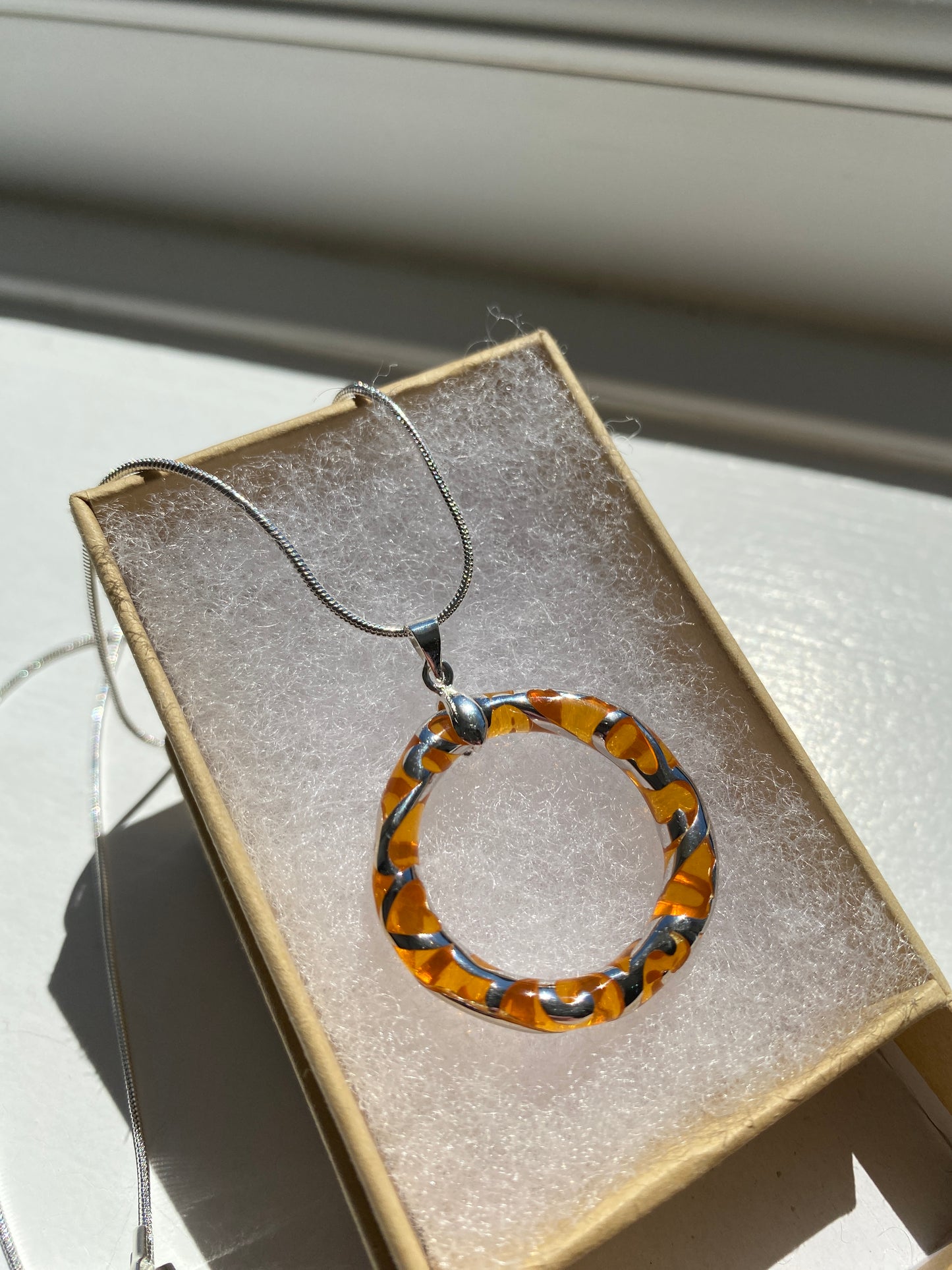 Circular Orange & Silver Pendant