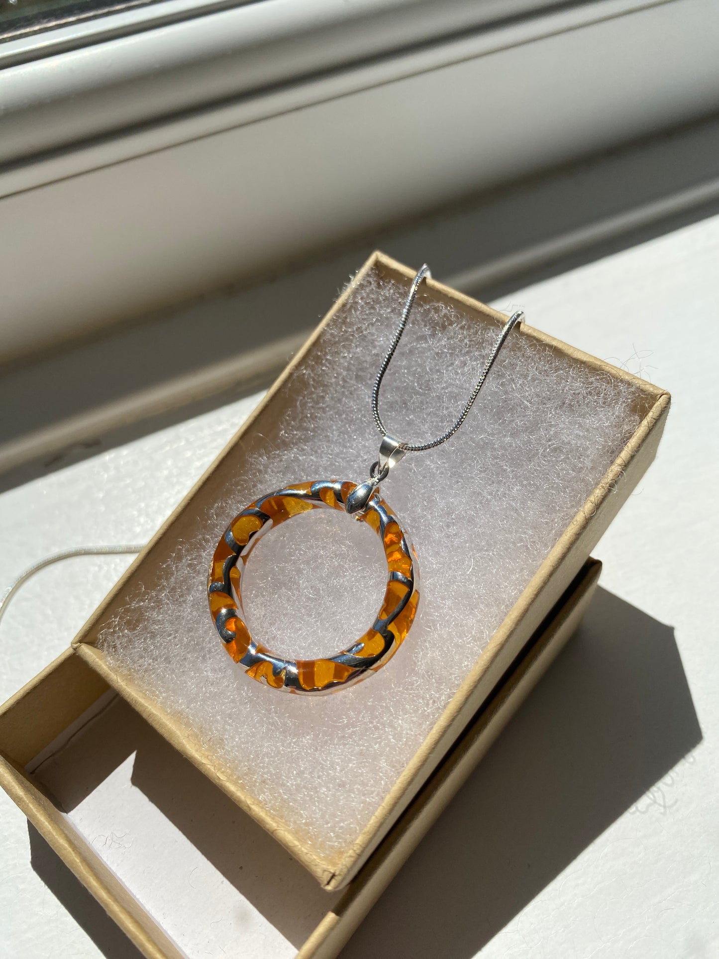 Circular Orange & Silver Pendant